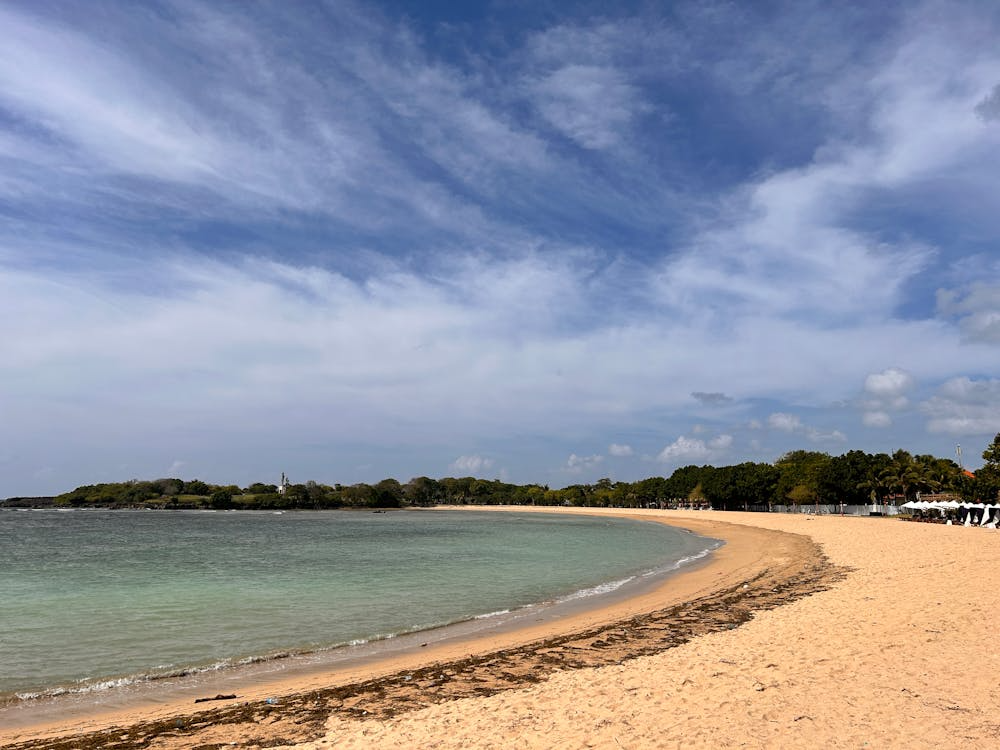 Bali beaches featuring golden sands, crystal-clear waters, and stunning coastal scenery, offering the perfect setting for relaxation, swimming, and seaside adventures.