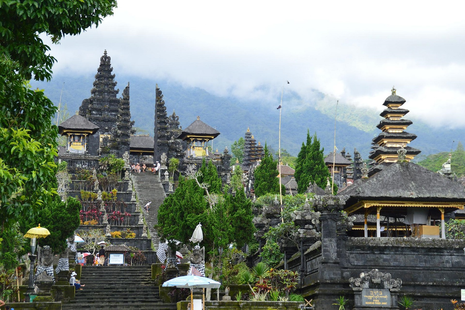Visitors exploring one of the most famous Bali heritage sites surrounded by lush greenery
