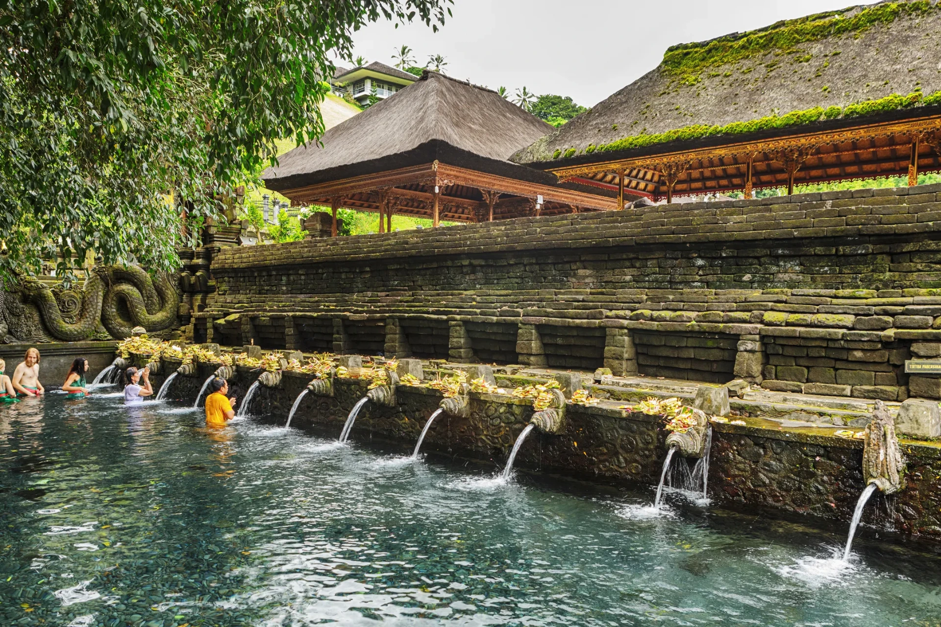 Visitors exploring one of the most famous Bali heritage sites surrounded by lush greenery