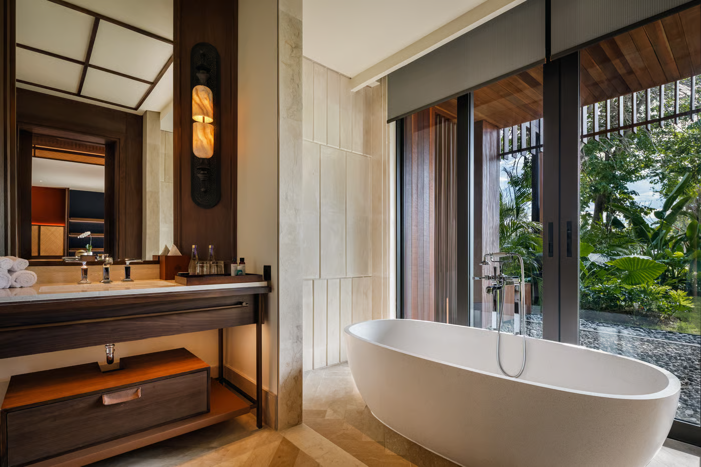 Bali hotels 5 star showcasing an infinity pool overlooking the coastline at sunset