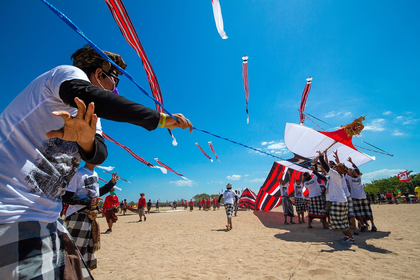 Colorful giant kites soaring above the beach during the Bali Kite Festival Sanur