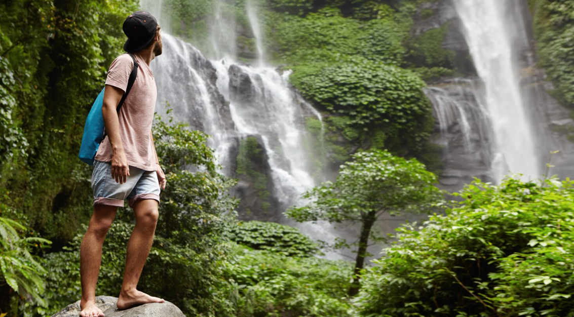 Travelers exploring Bali waterfalls through scenic jungle trails, hidden swimming spots, and picturesque landscapes perfect for adventure and relaxation.