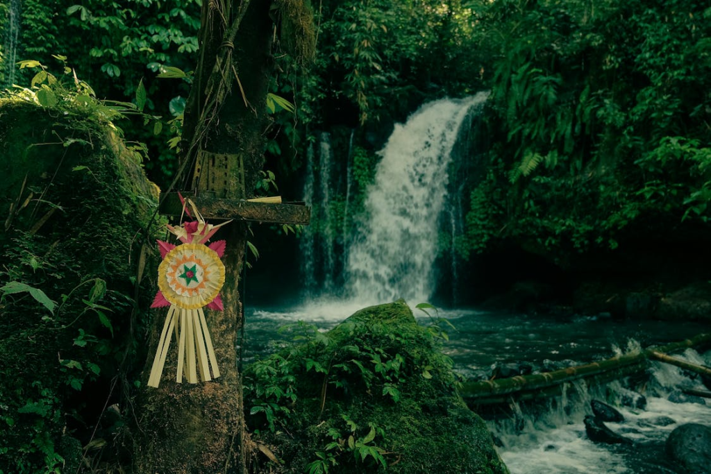 Travelers exploring Bali waterfalls through scenic jungle trails, hidden swimming spots, and picturesque landscapes perfect for adventure and relaxation.