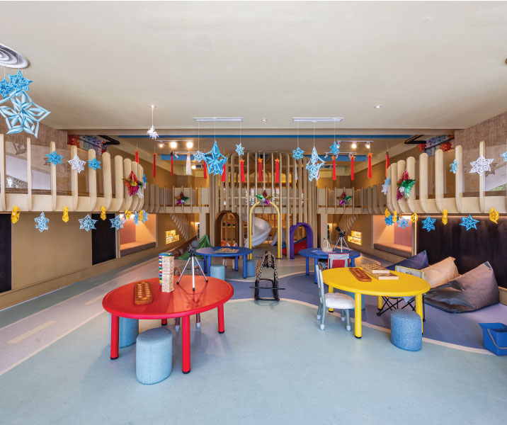 Parents and children enjoying a relaxing stay at family-friendly hotels with safe play areas, family suites, and convenient amenities for all ages.