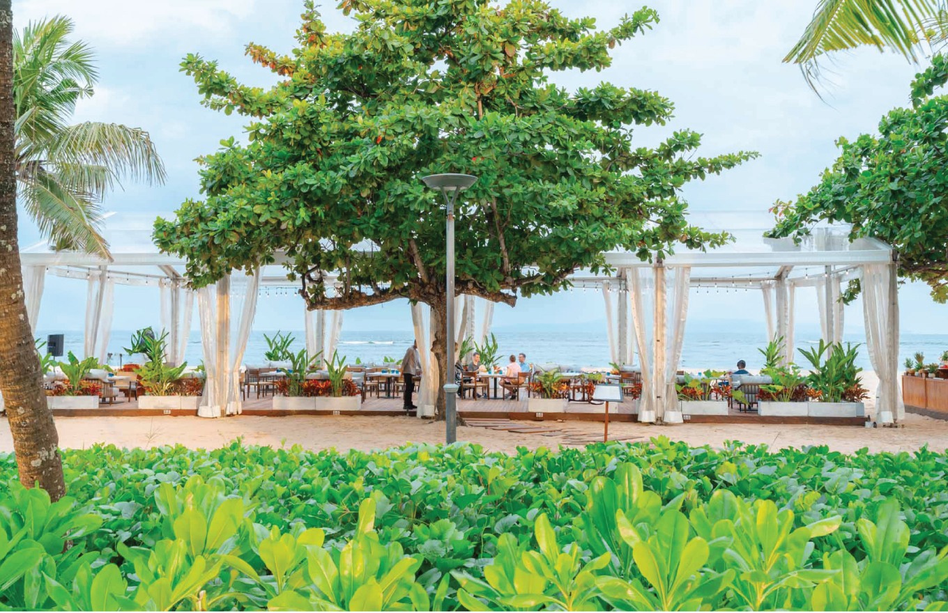 Couple celebrating a luxury wedding in Sanur, Bali at a five-star resort with personalized wedding services, tropical gardens, and a stunning seaside setting.
