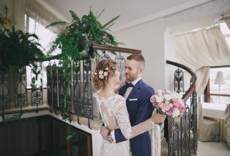 Couple celebrating a luxury wedding in Sanur, Bali at a five-star resort with personalized wedding services, tropical gardens, and a stunning seaside setting.