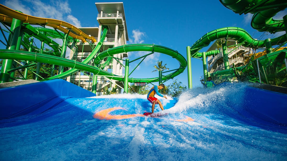 Family enjoying one of the best things to do in Bali with kids at a water park